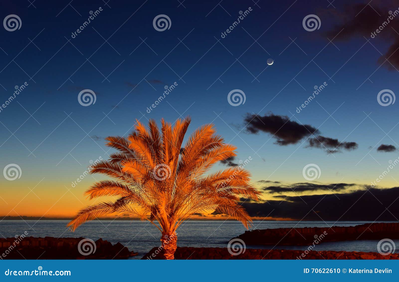 sunset on beach with moonrise in madeira insel,