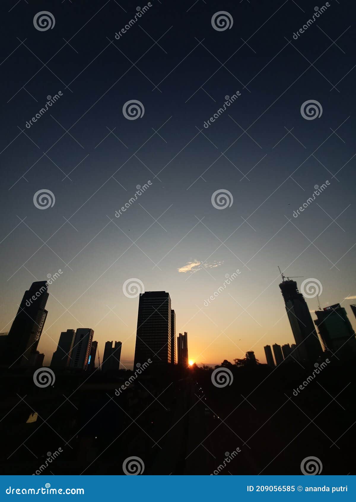 sunset behind the skyscrappers in south jakarta, indonesia