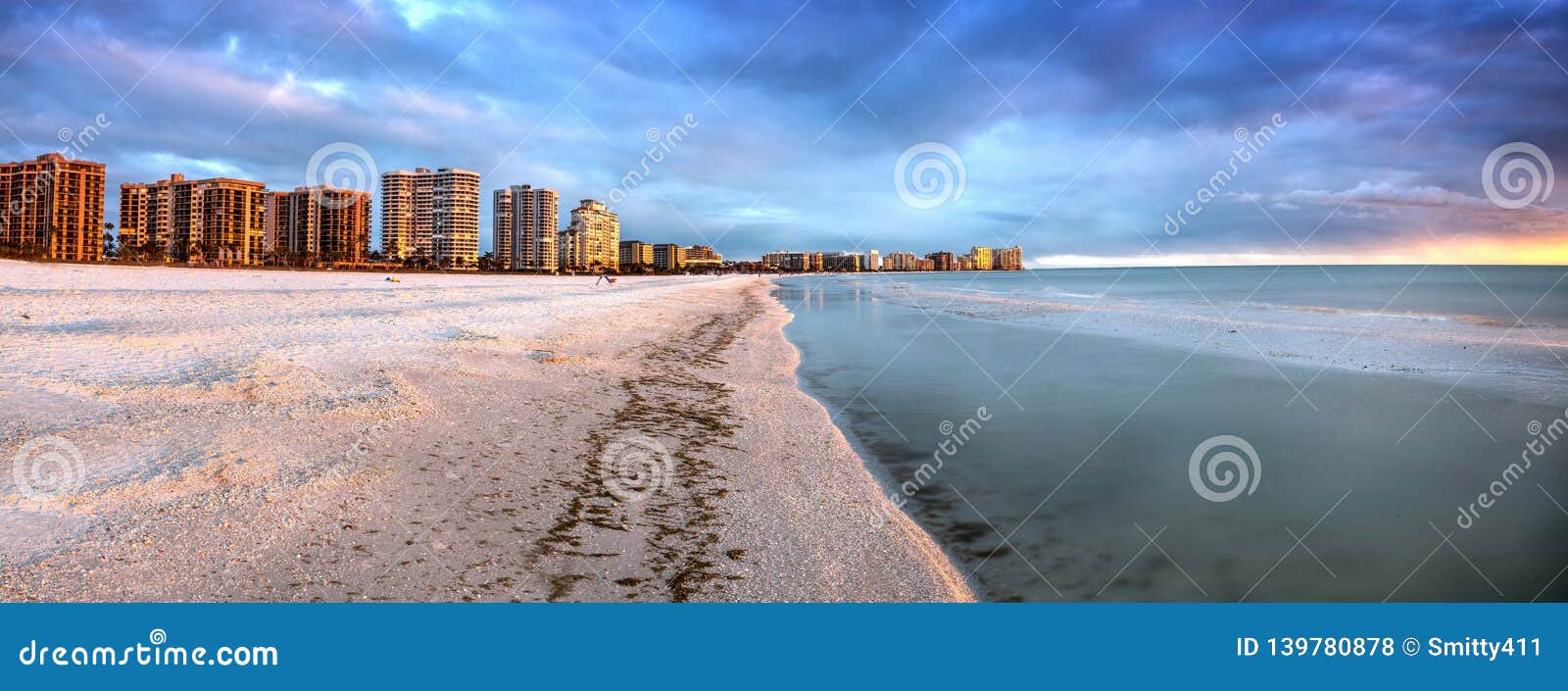 sunset and clouds over the calm water of tigertail beach on marco island