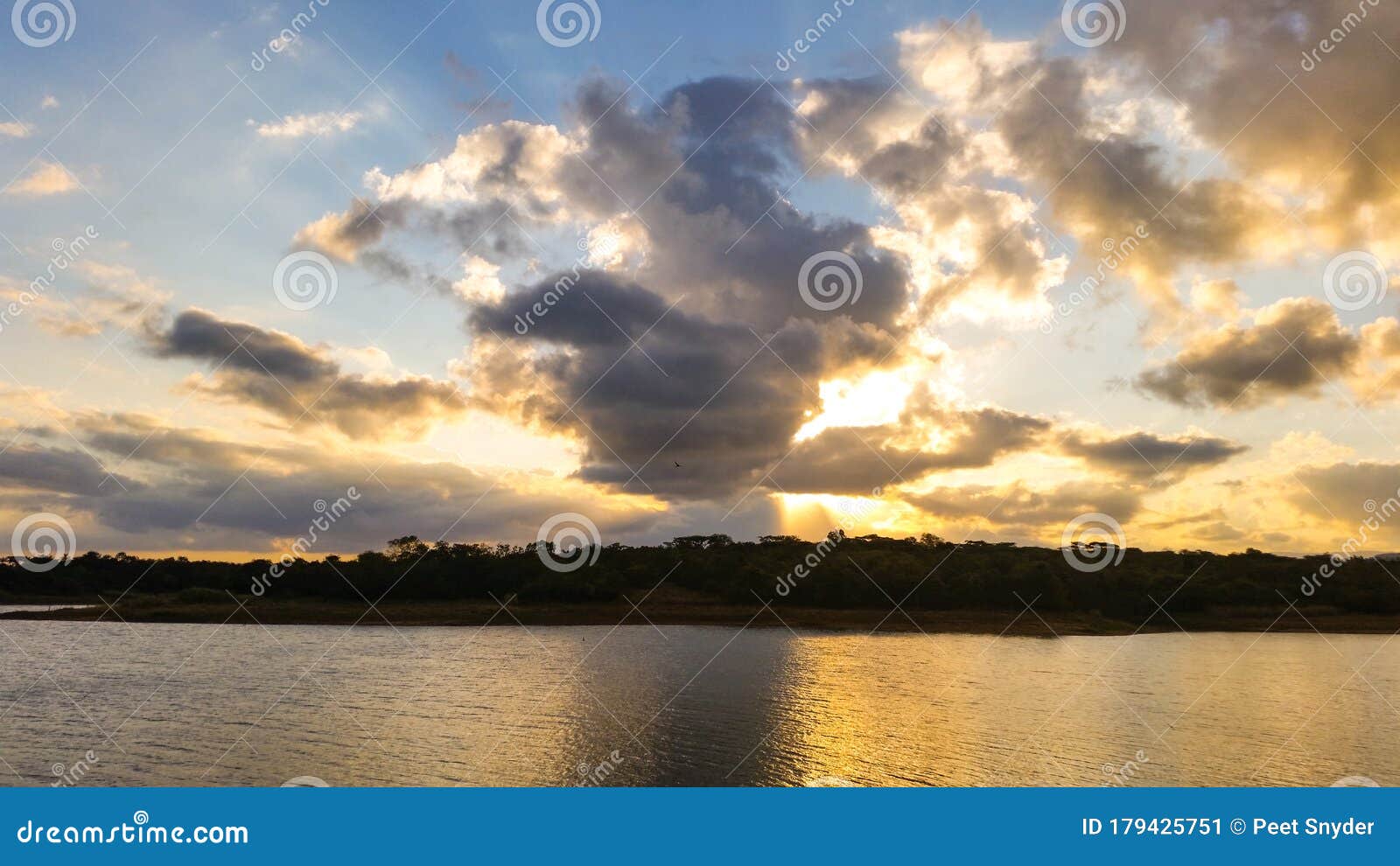 Sunset on a Cloudy Day at the Lake Stock Image Image of river, shore 179425751