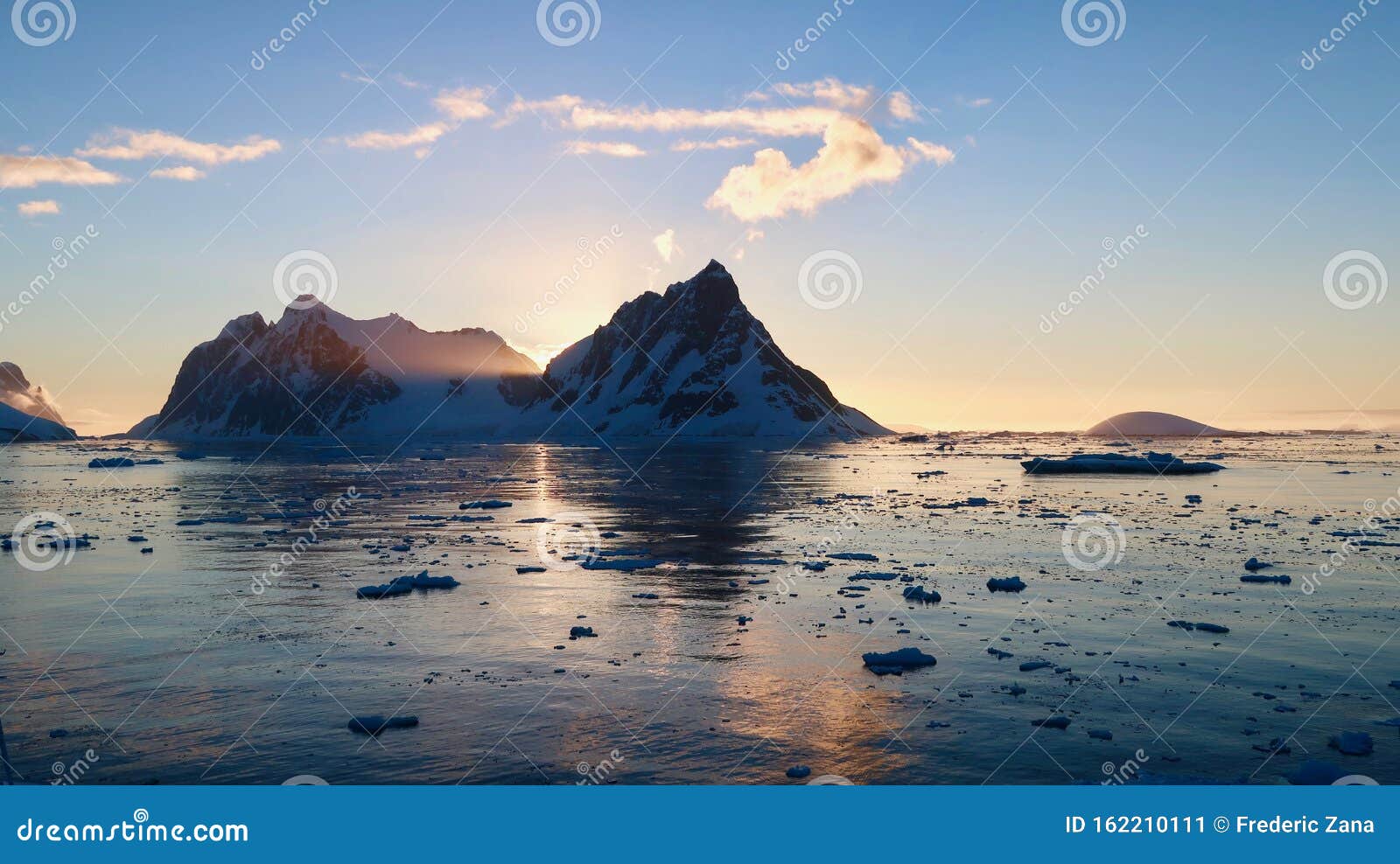 sunset at the entrance of the lemaire channel in antarctica.