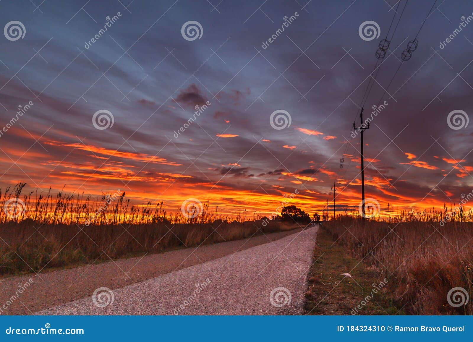 sunset landscape with electric lying nuves yellow fire road
