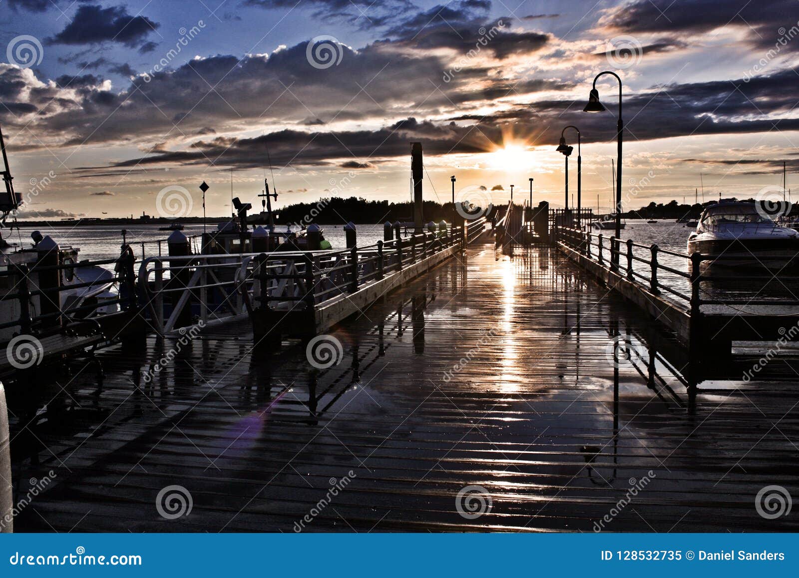 Sunset Light Reflecting on Wet Fishing Pier Stock Image - Image of