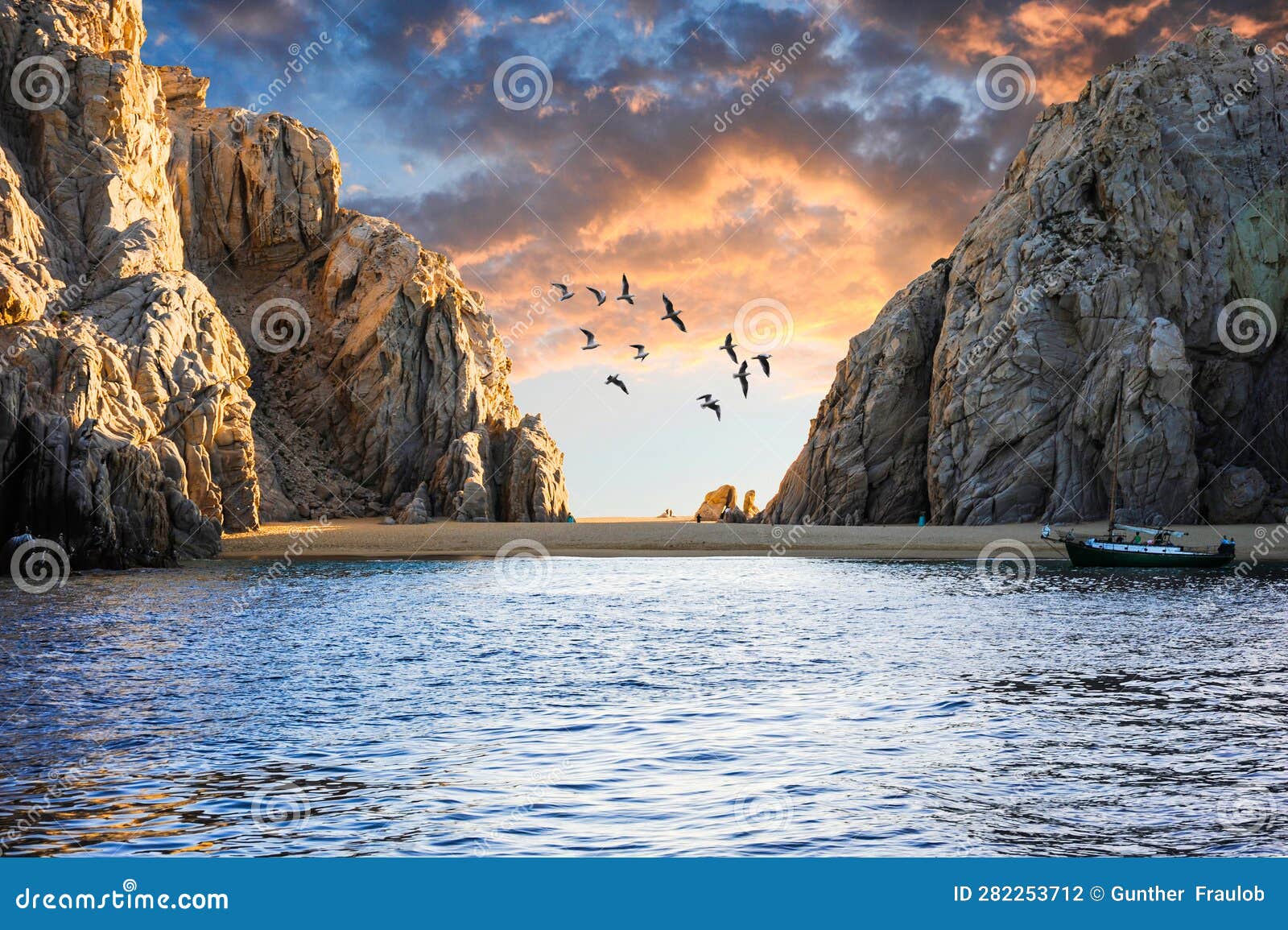 sunset on a little beach close to cabo san lucas' el arco arch.