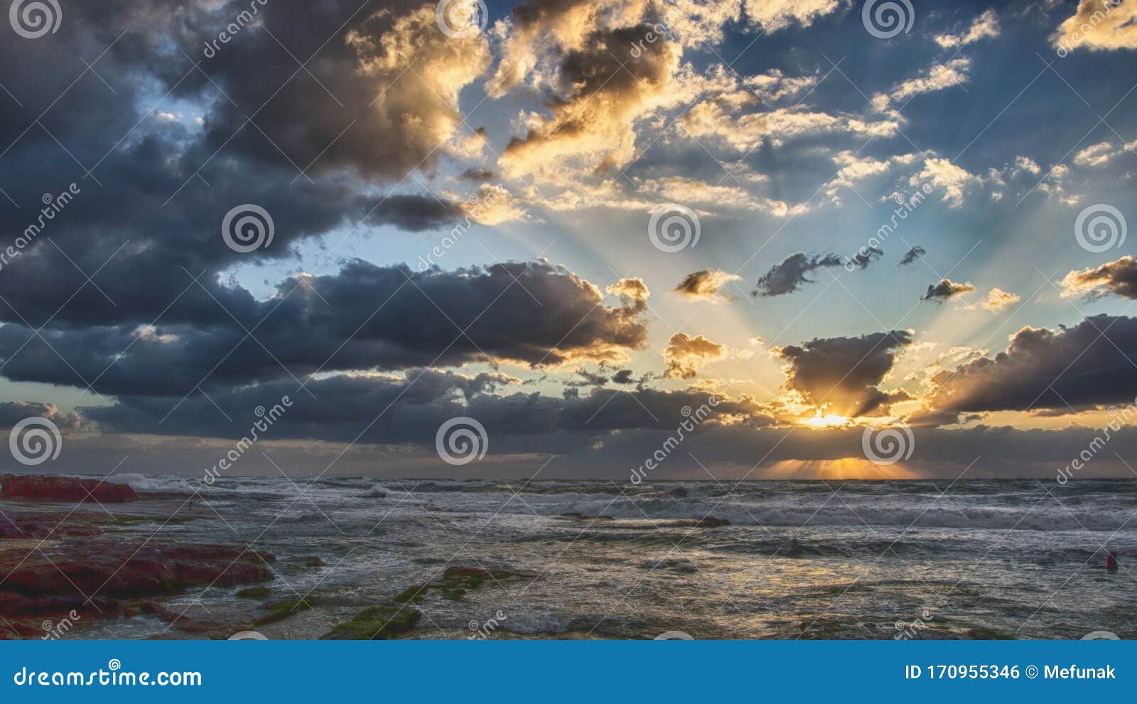 the sunset at the mediterranian sea at palmachim beach, israel