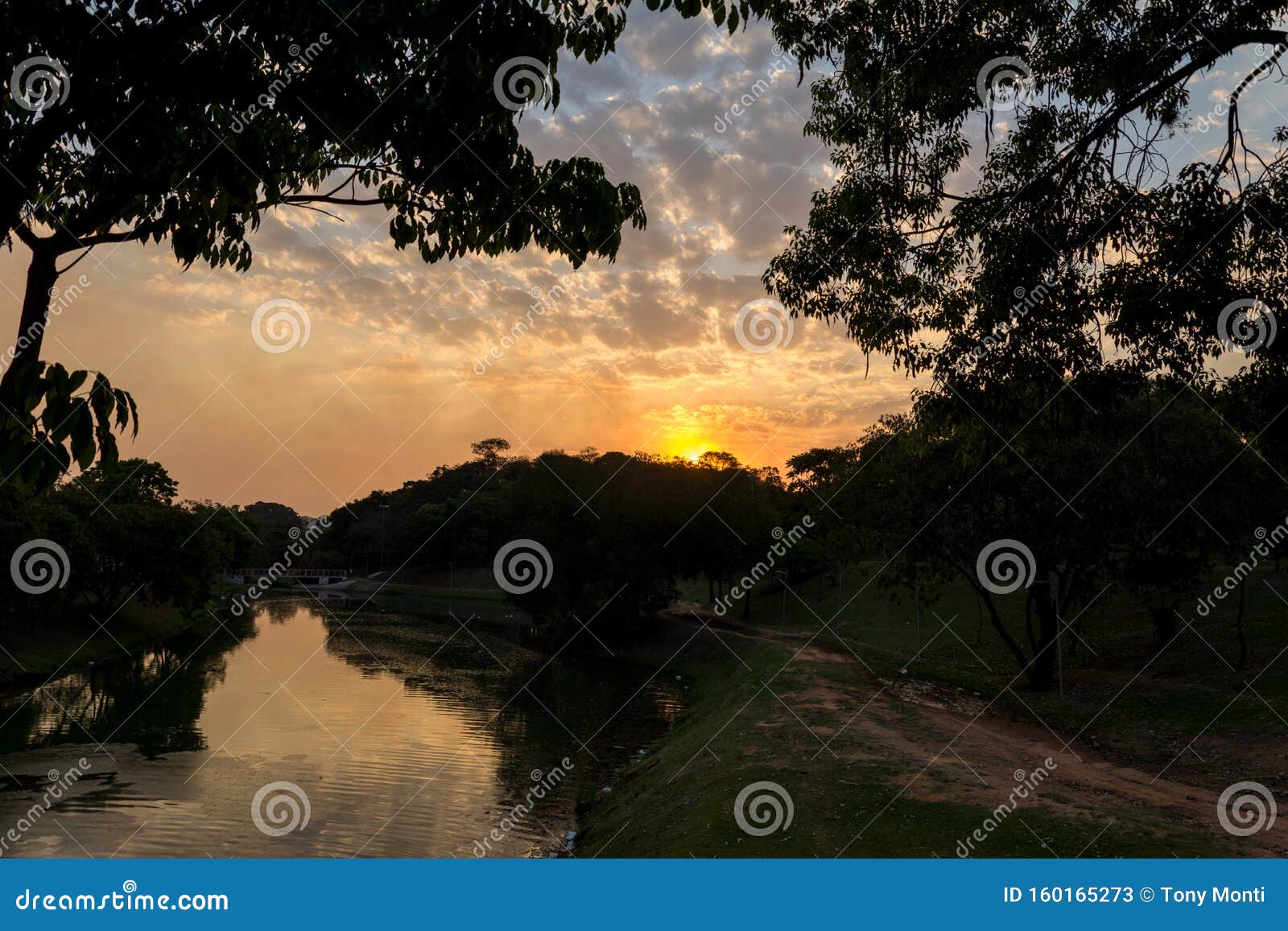 sunset near the river, in the ecological park, in indaiatuba, brazil