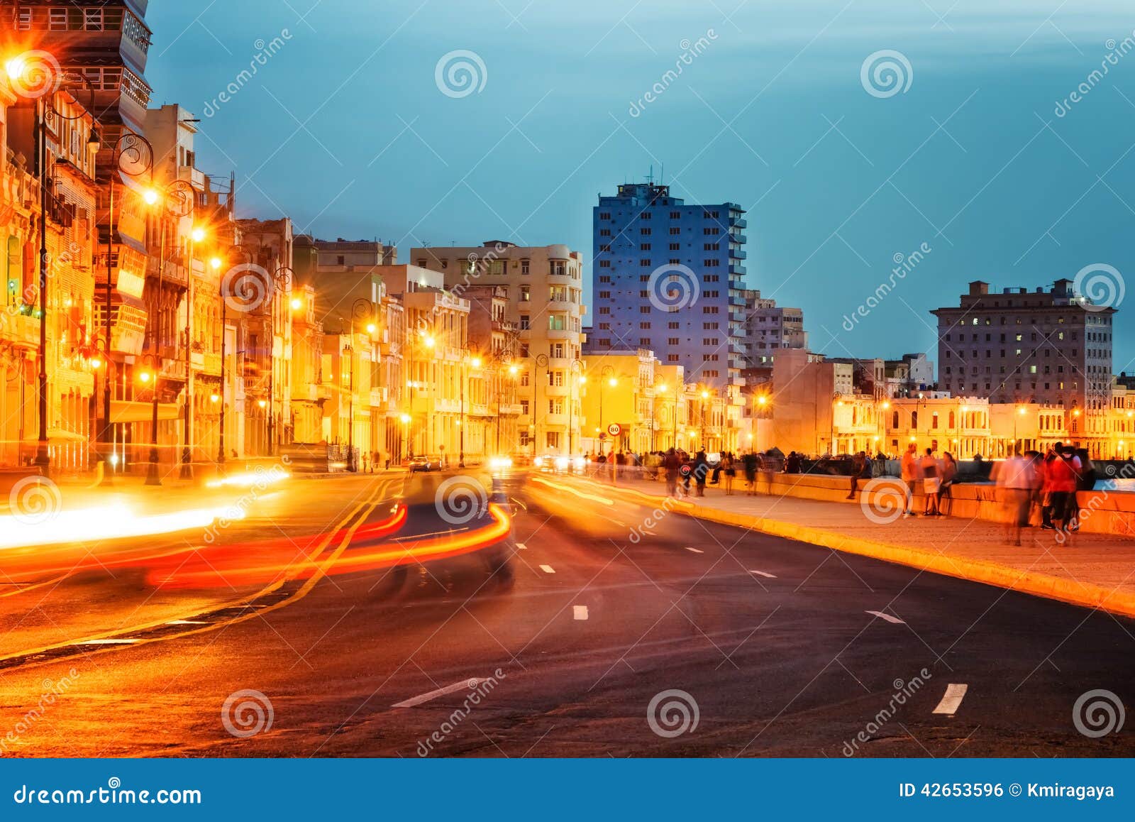 sunset in old havana with the street lights of el malecon