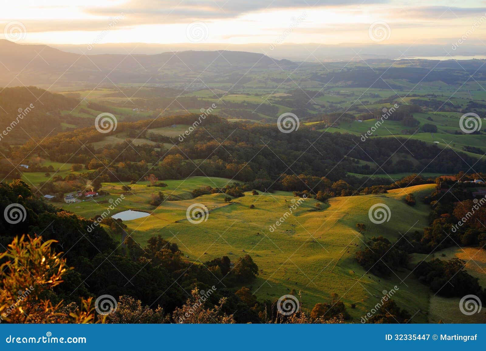vast view hilly landscape at coastal region in australia by sunset