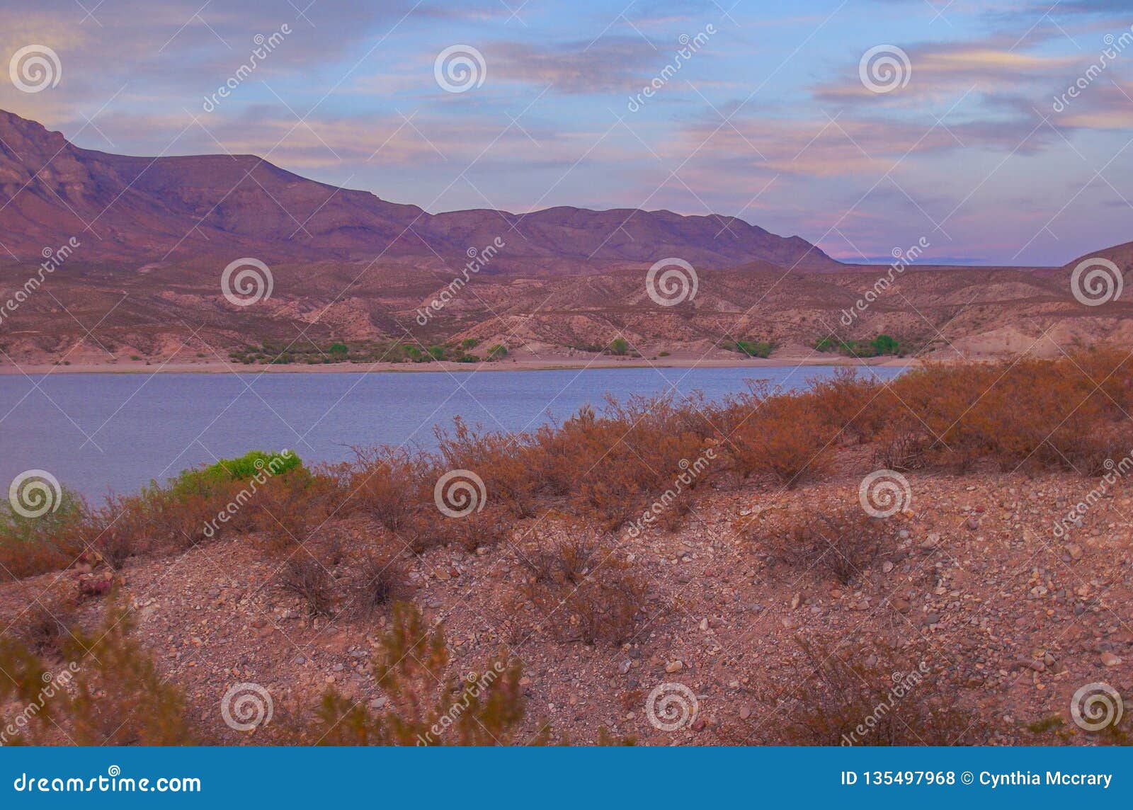 sunset over caballo mountains and lake