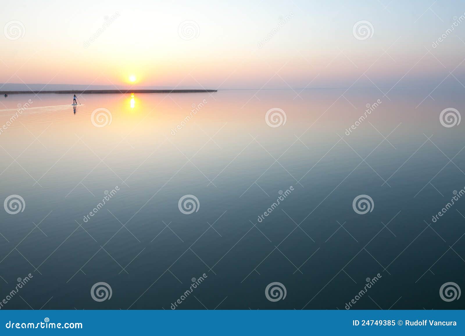 sunset over calm lake