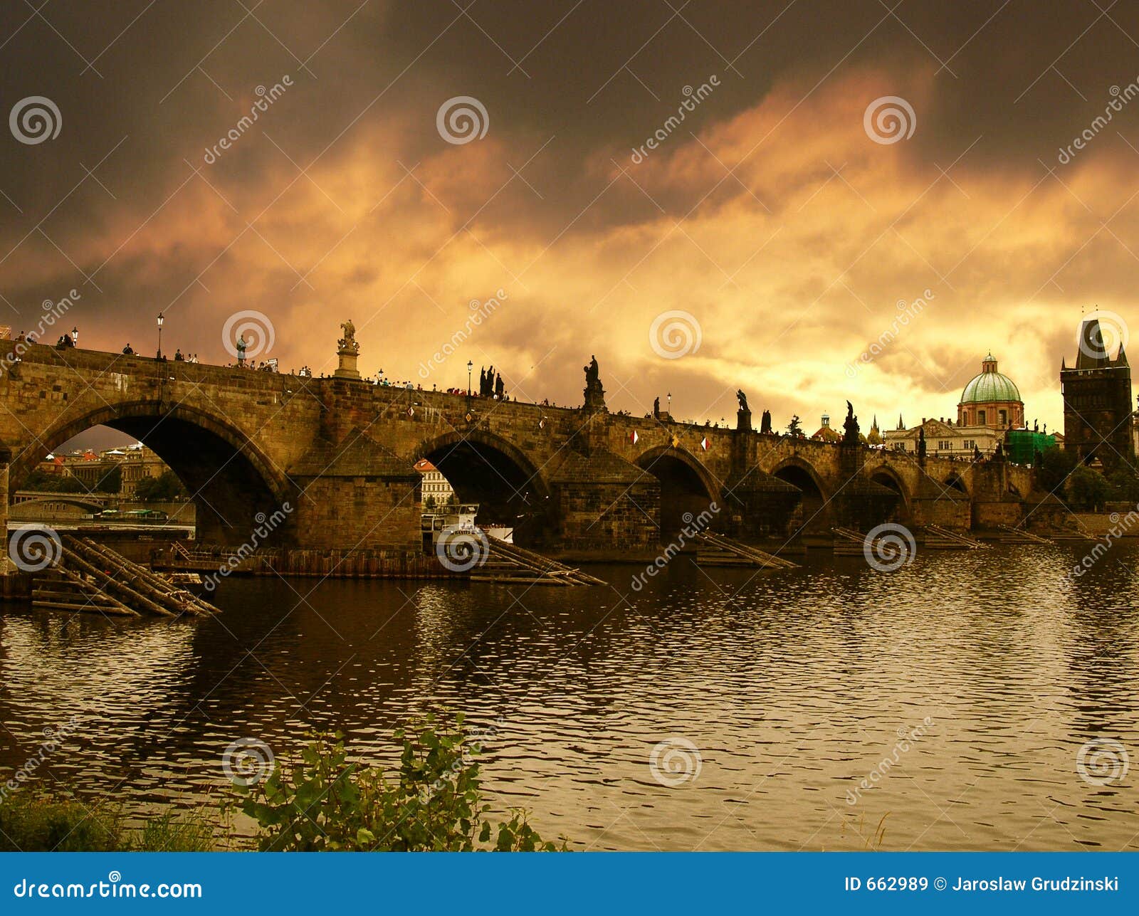 sunset over charles bridge in prague