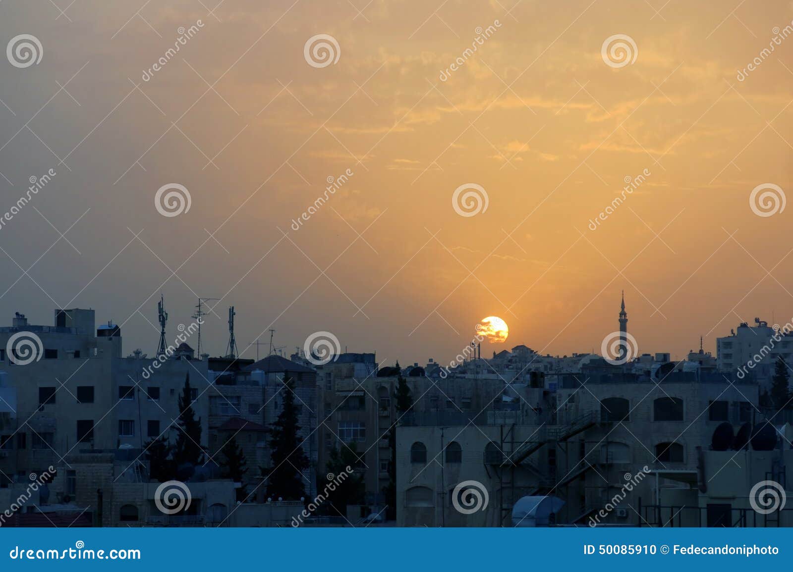 sunset over the city of amman in jordan in the middle east