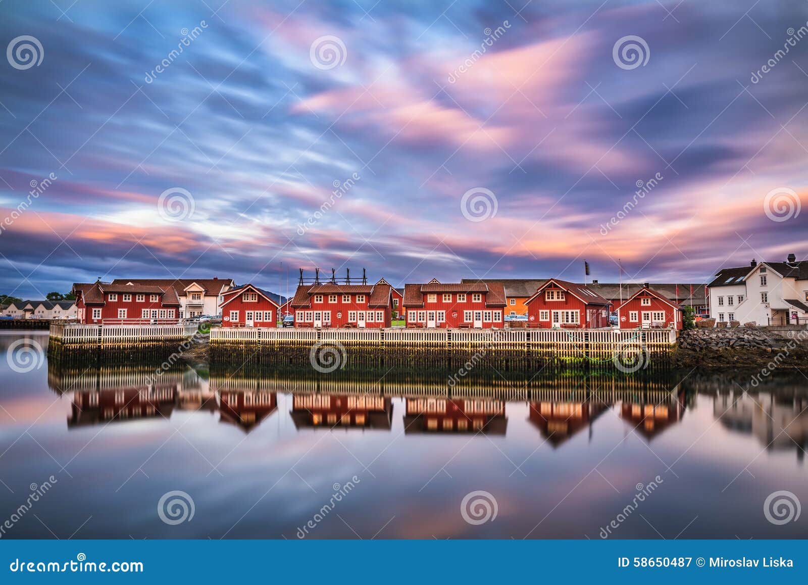 sunset over harbor houses in svolvaer, lofoten islands, norway