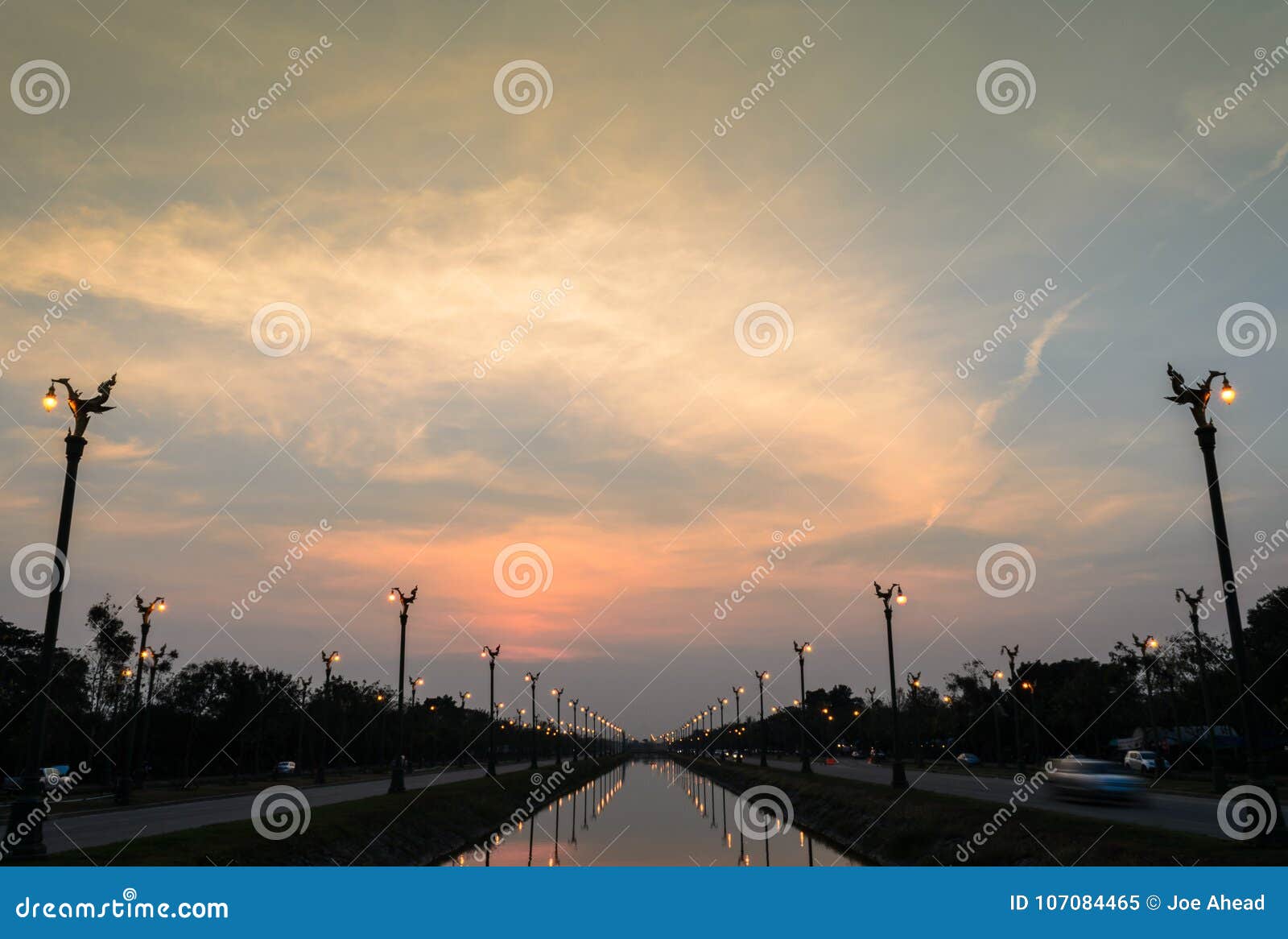 Sunset Over a Highway Utthayan Road and Reflection on the River. Stock