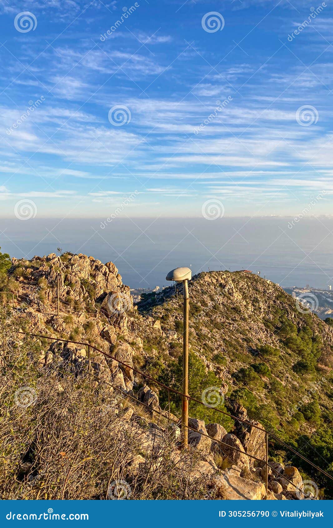 sunset over mediterranean sea and fuengirola from calamorro peak