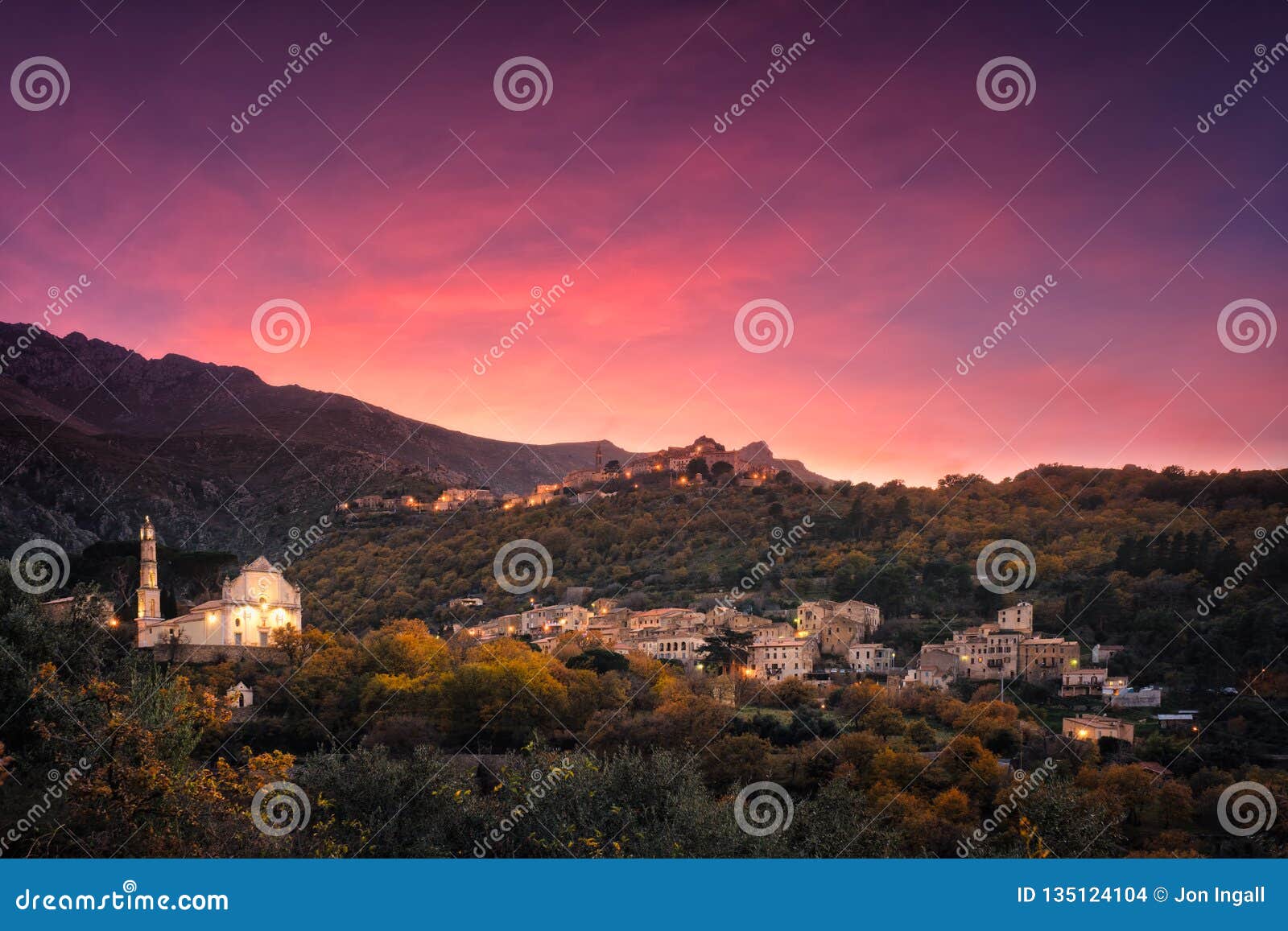 sunset over mountain villages in corsica