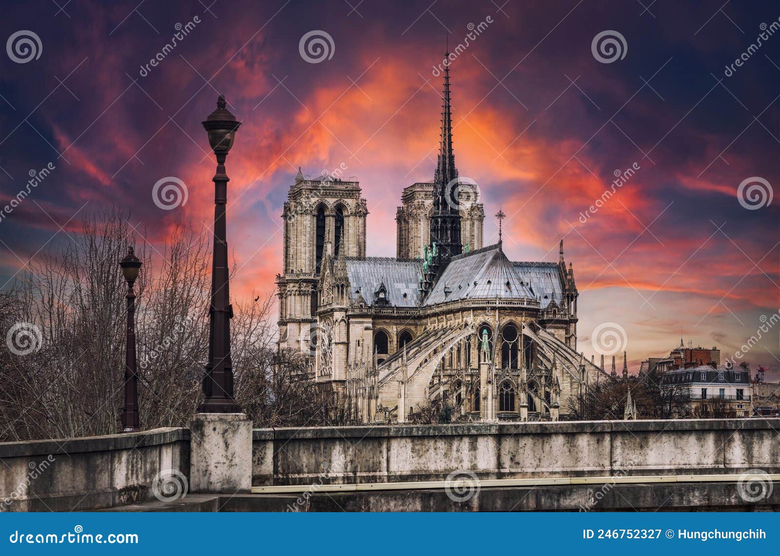 sunset over the notre-dame cathedral in paris - fance