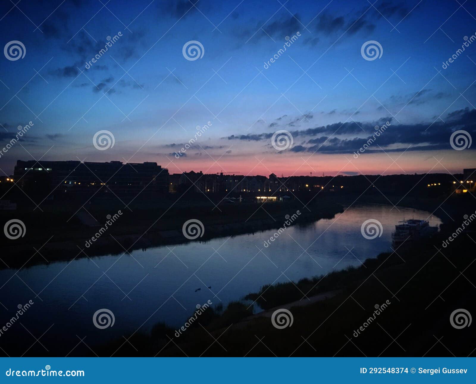 sunset over the warta river in pozna?, poland, june 2019