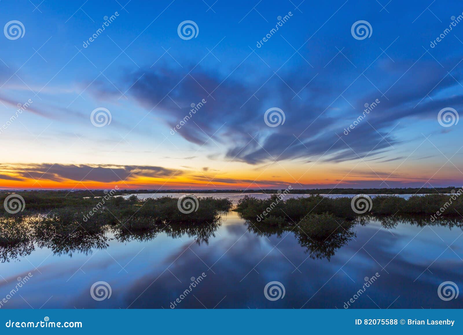 sunset over water - merritt island wildlife refuge, florida