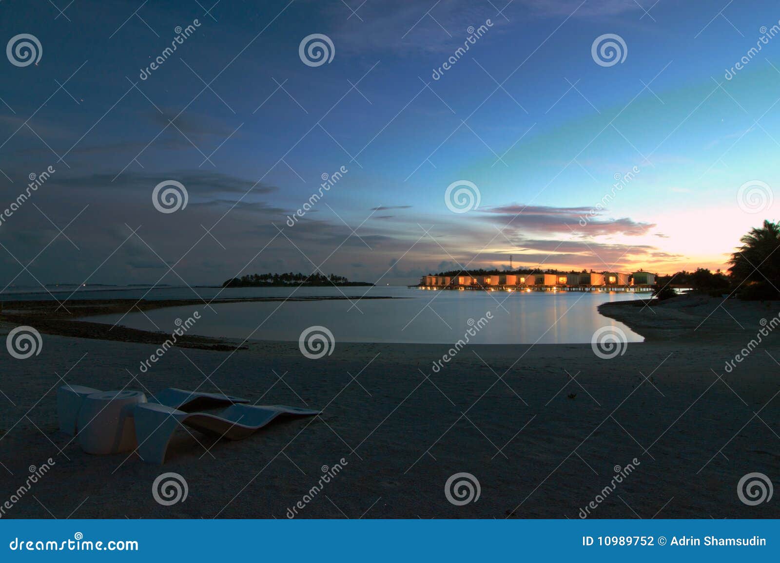 sunset over water villas