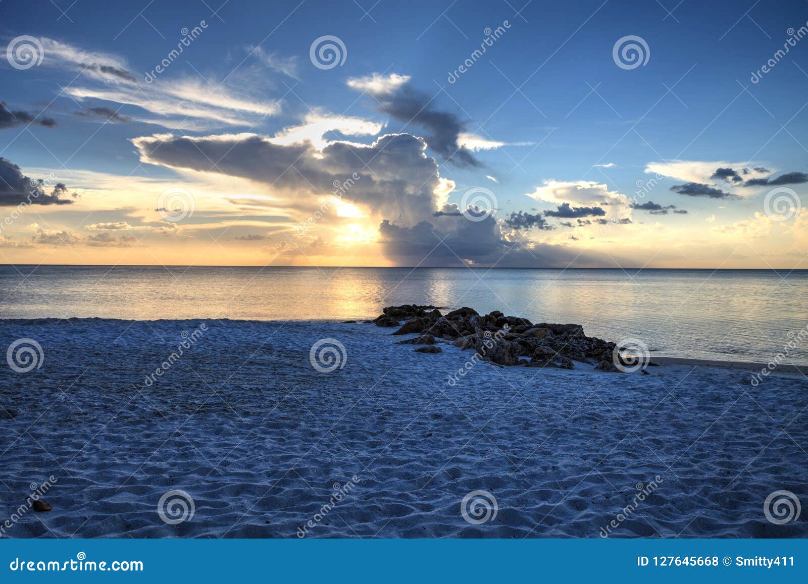 Sunset Over the White Sand on Naples Beach in Naples, Florida Stock