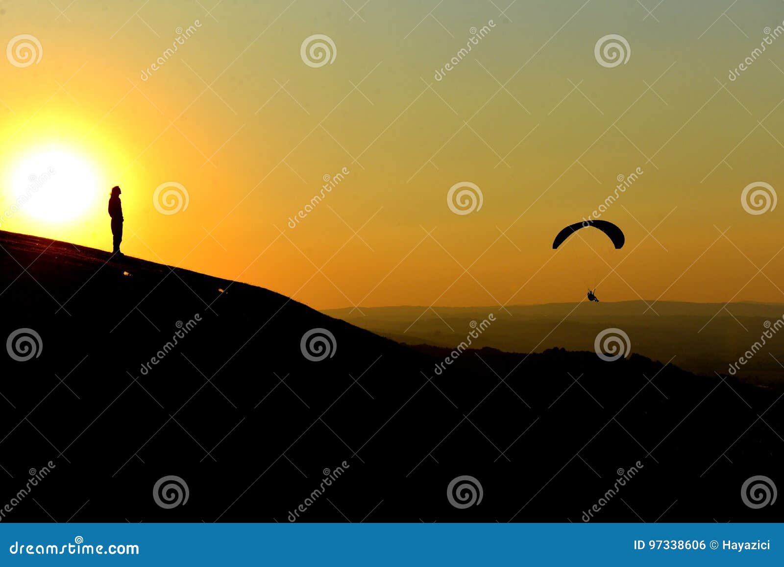 sunset and paragliding