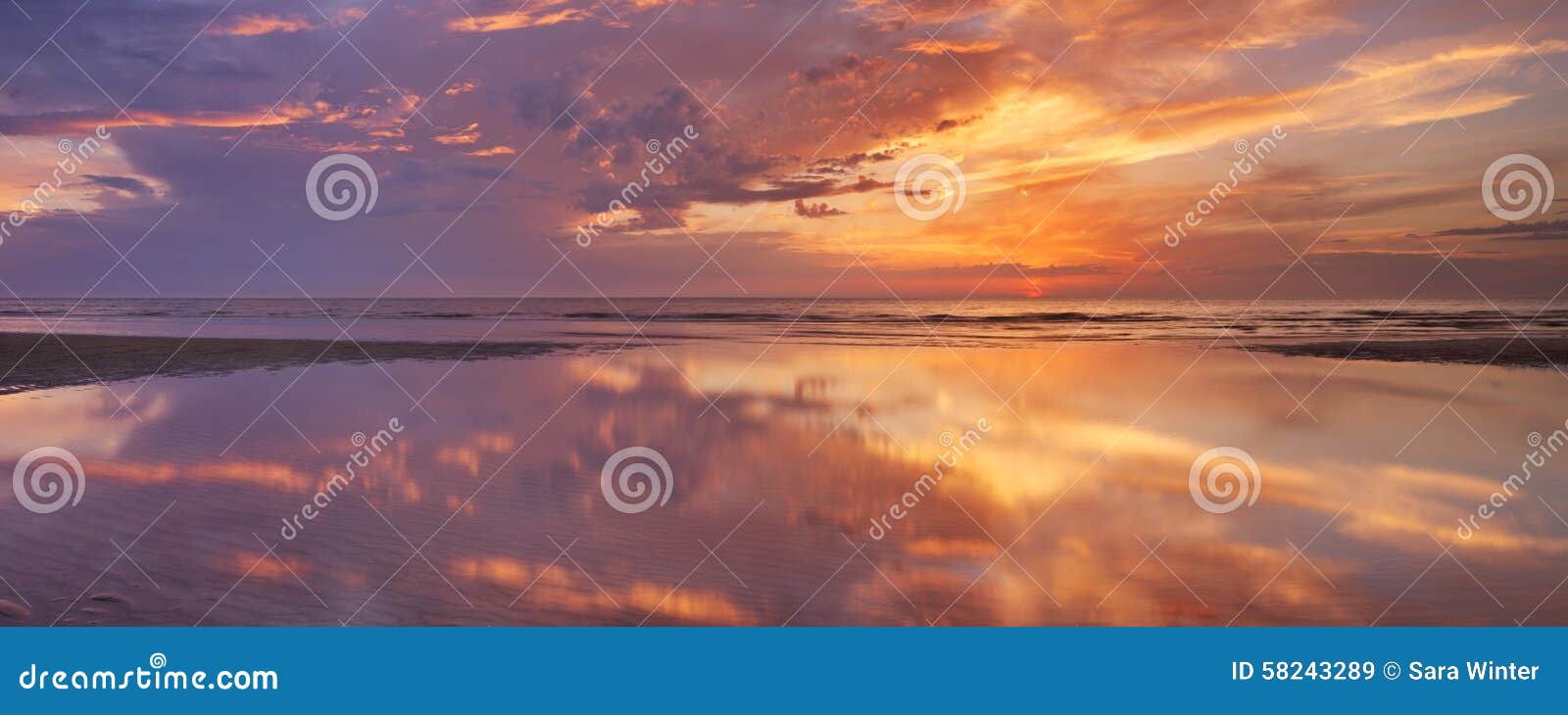 sunset reflections on the beach, texel island, the netherlands