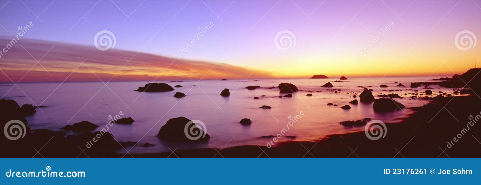 sunset on rocky pacific shoreline