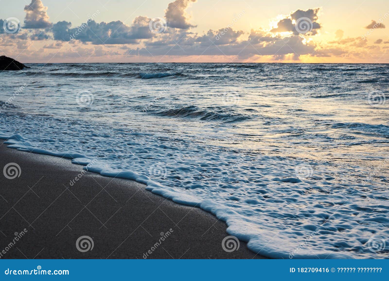 Sunset At The Rocky Sea Turquoise Water In The Ocean In The Evening