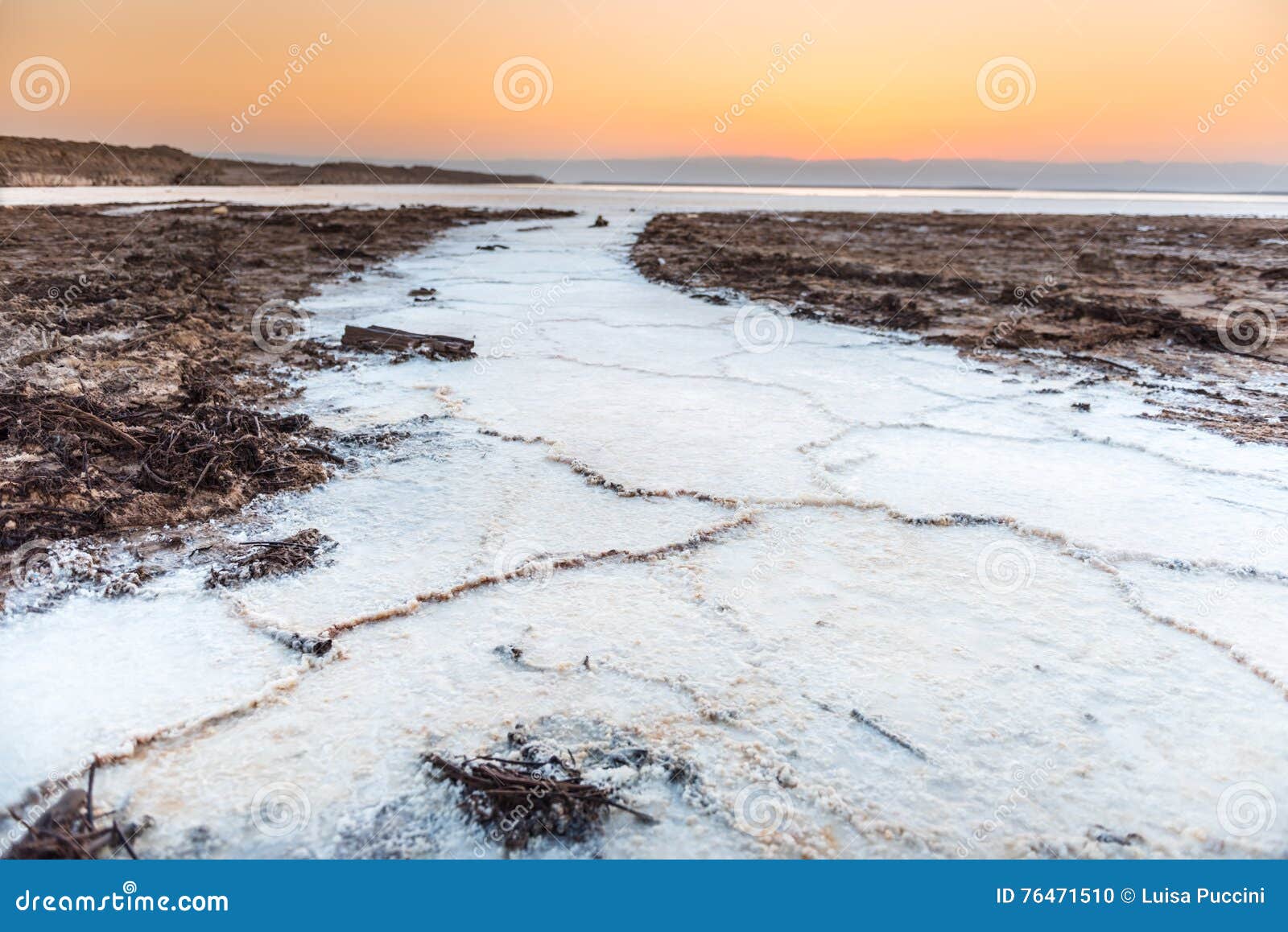 sunset on salt crystals in the dead sea, jordan
