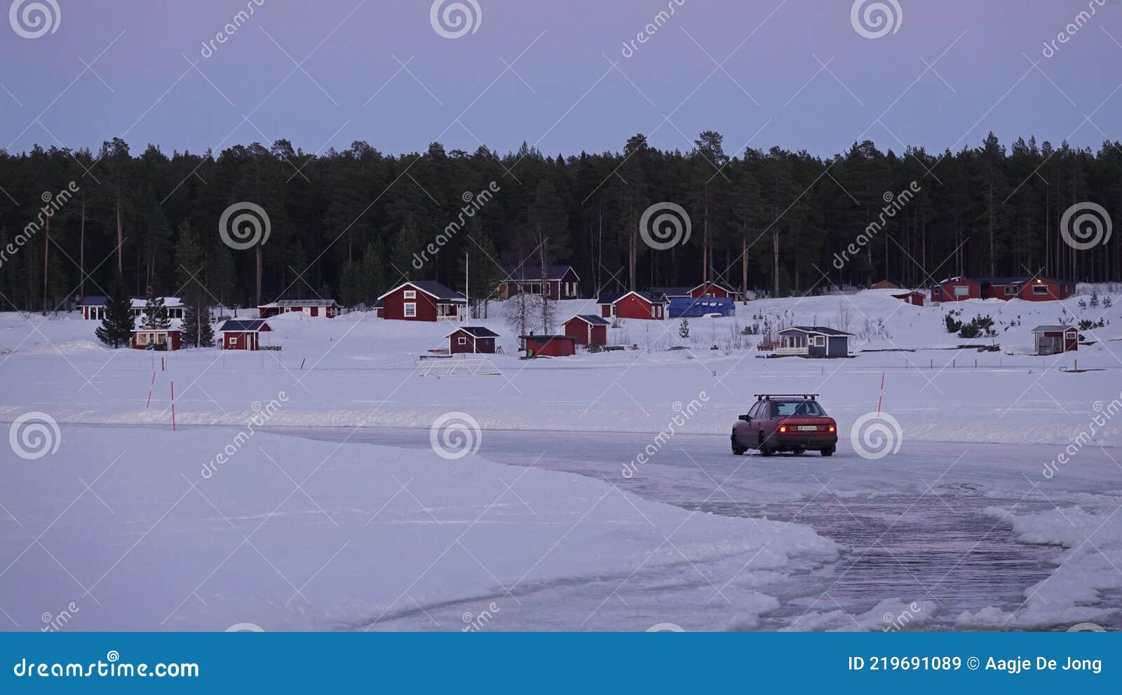 sunset at sandon island iceroad  in lulea archipelago in sweden
