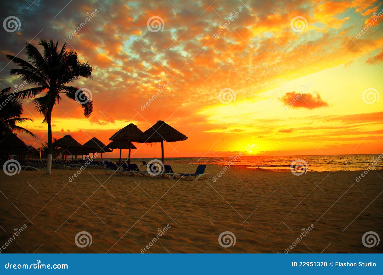 sunset scene at tropical beach resort