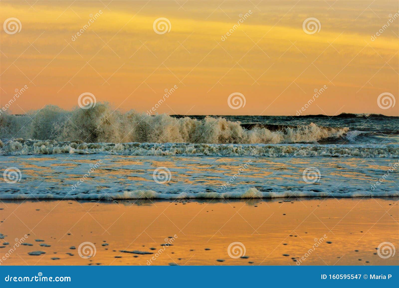 sunset in the sea nature landscape outdoors seascape beach waves, orange sky in the background, summer season