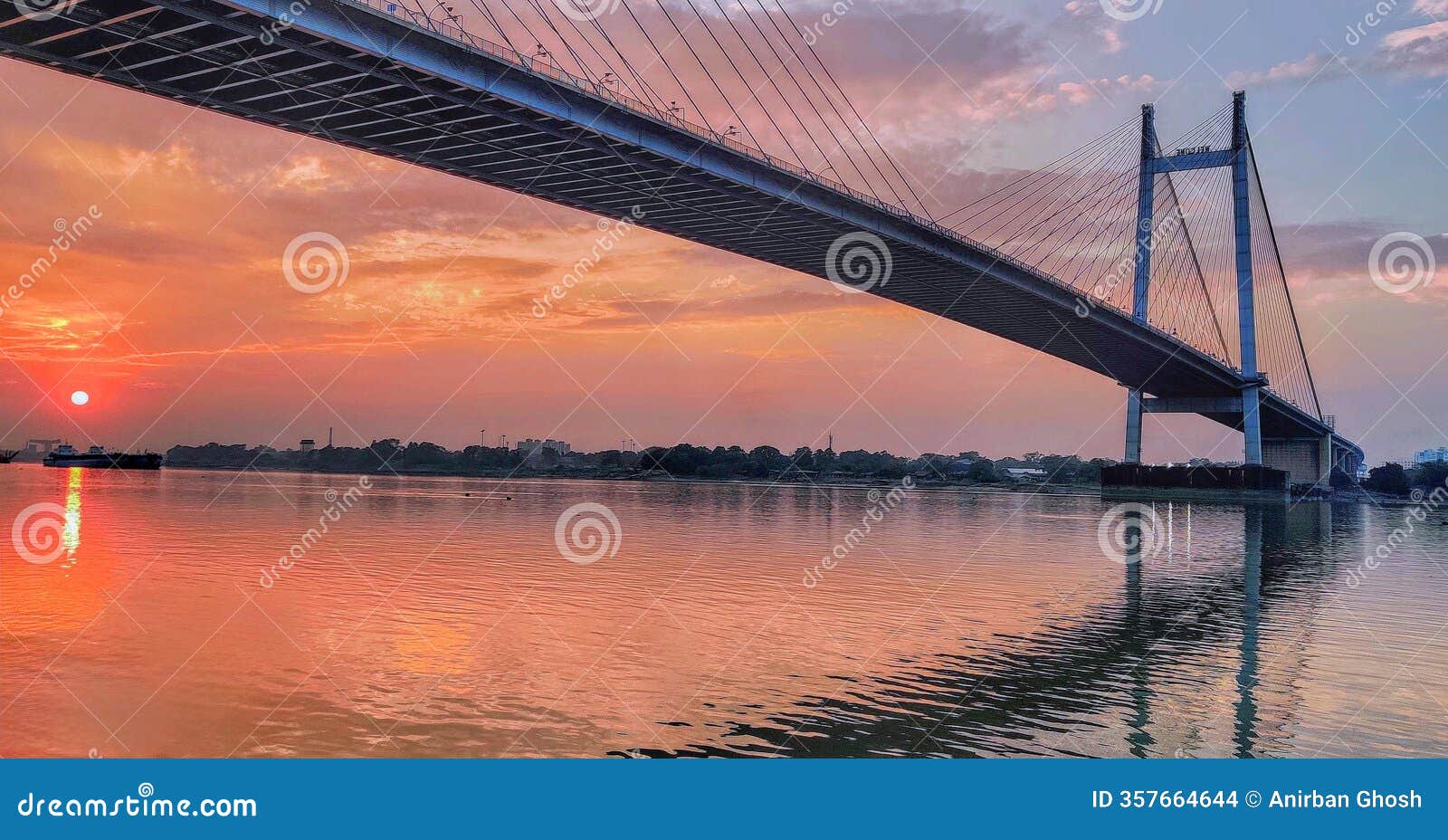 sunset serenity: the majestic vidyasagar bridge over hooghly river in kolkata