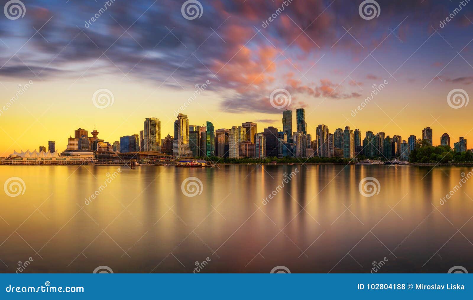 sunset skyline of vancouver downtown from stanley park