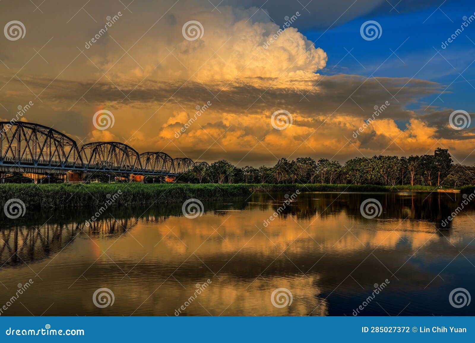 at sunset. the spectacular warren truss old railway bridge