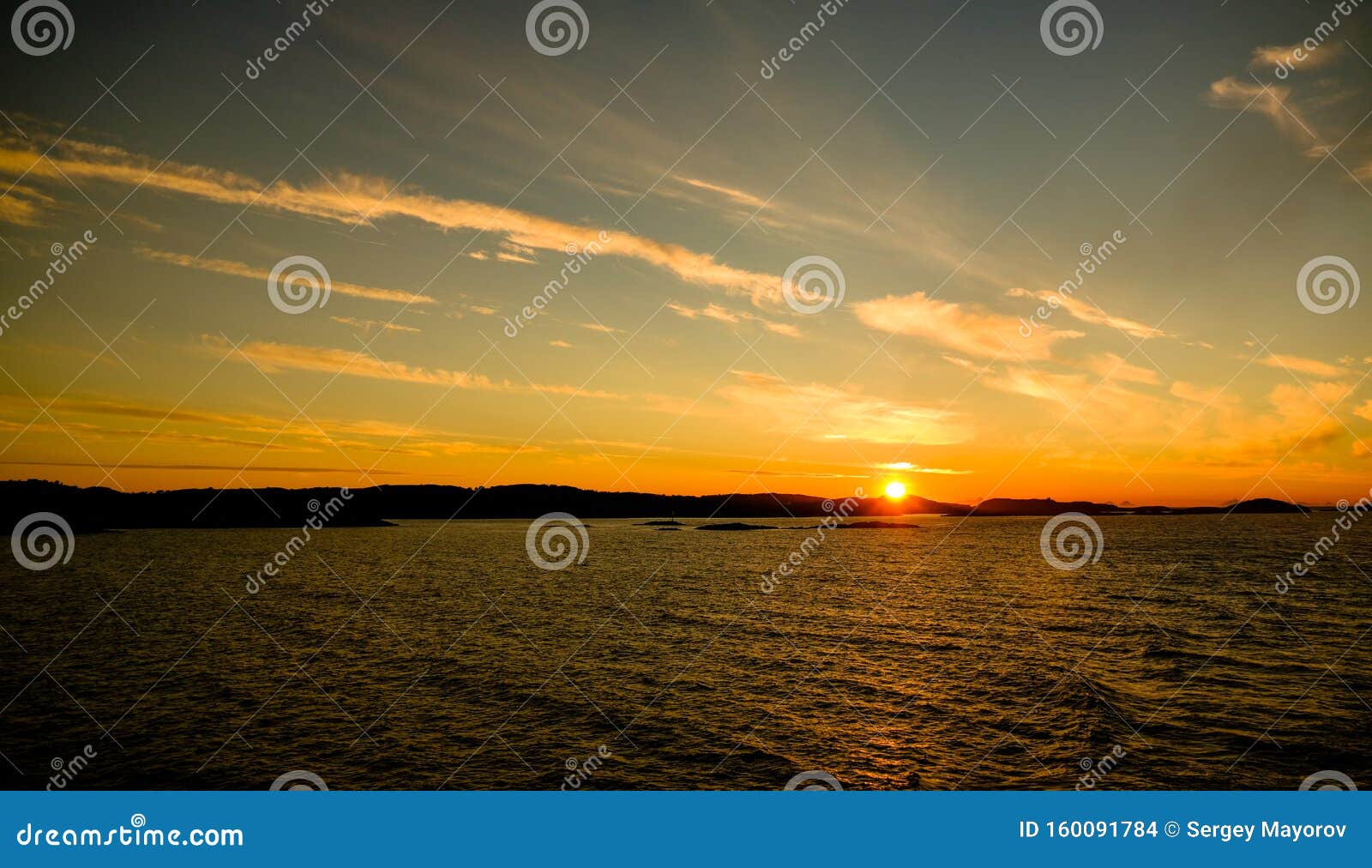 sunset and sunrise over the sea and lofoten archipelfgo from the moskenes - bodo ferry , norway