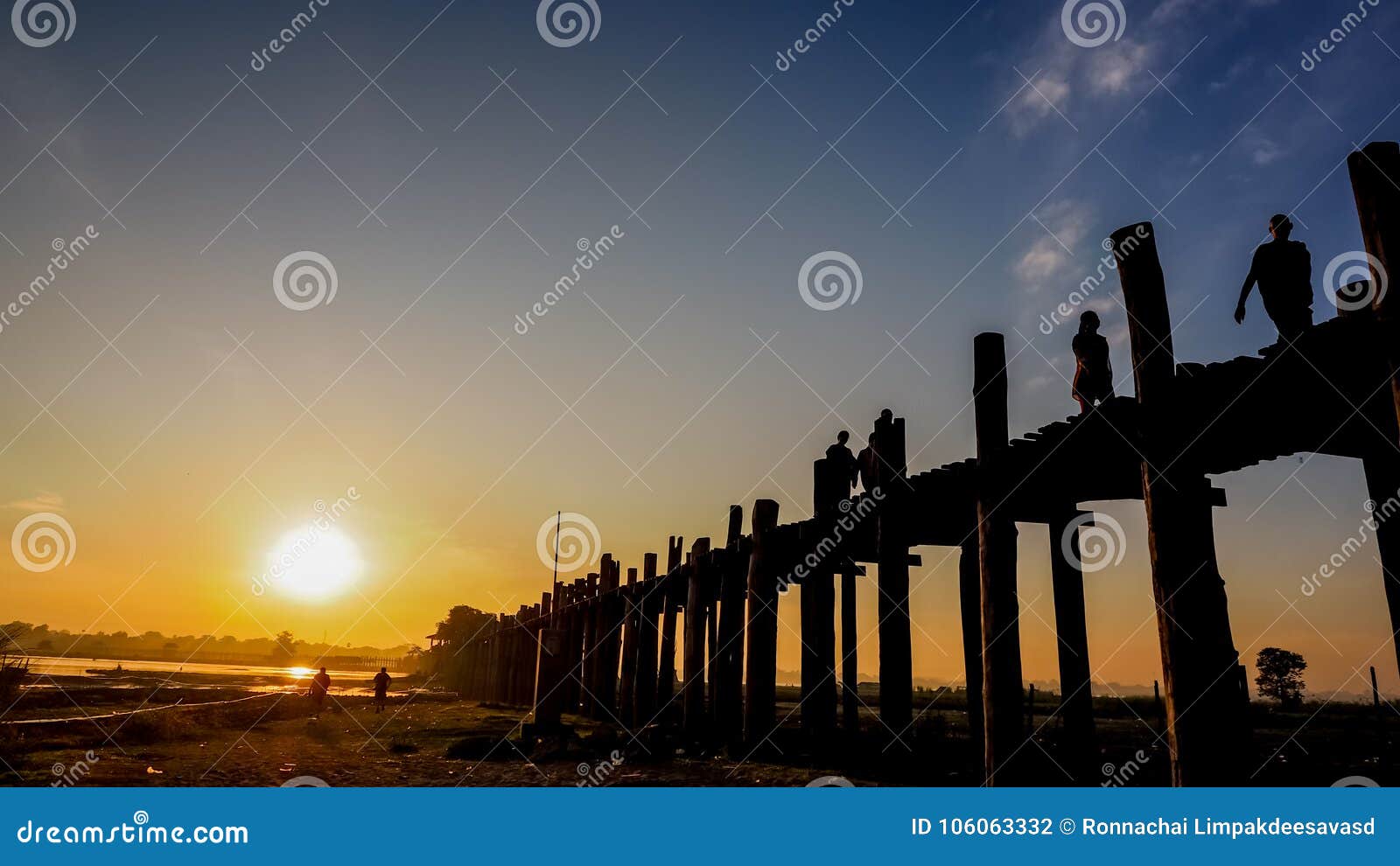 sunset in u bein bridge with vintage boat myanmar. u bein bridge is longest teak