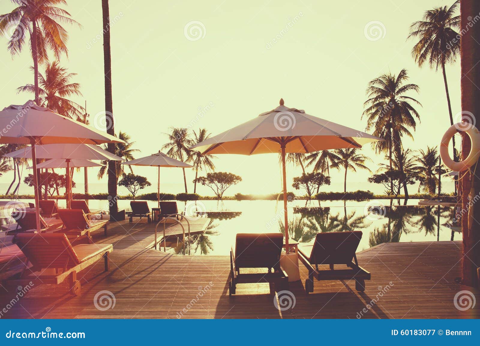 Sunset with Umbrella and Deck Chair by the Pool Stock Image Image of