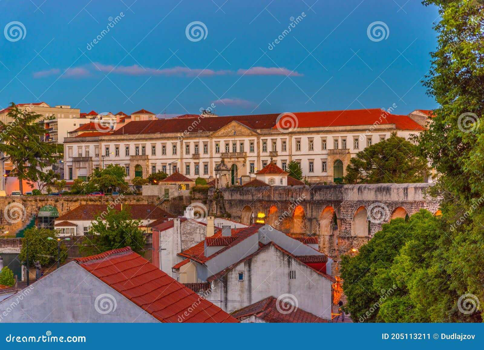 sunset view of coimbra dominated by a military building, portugal