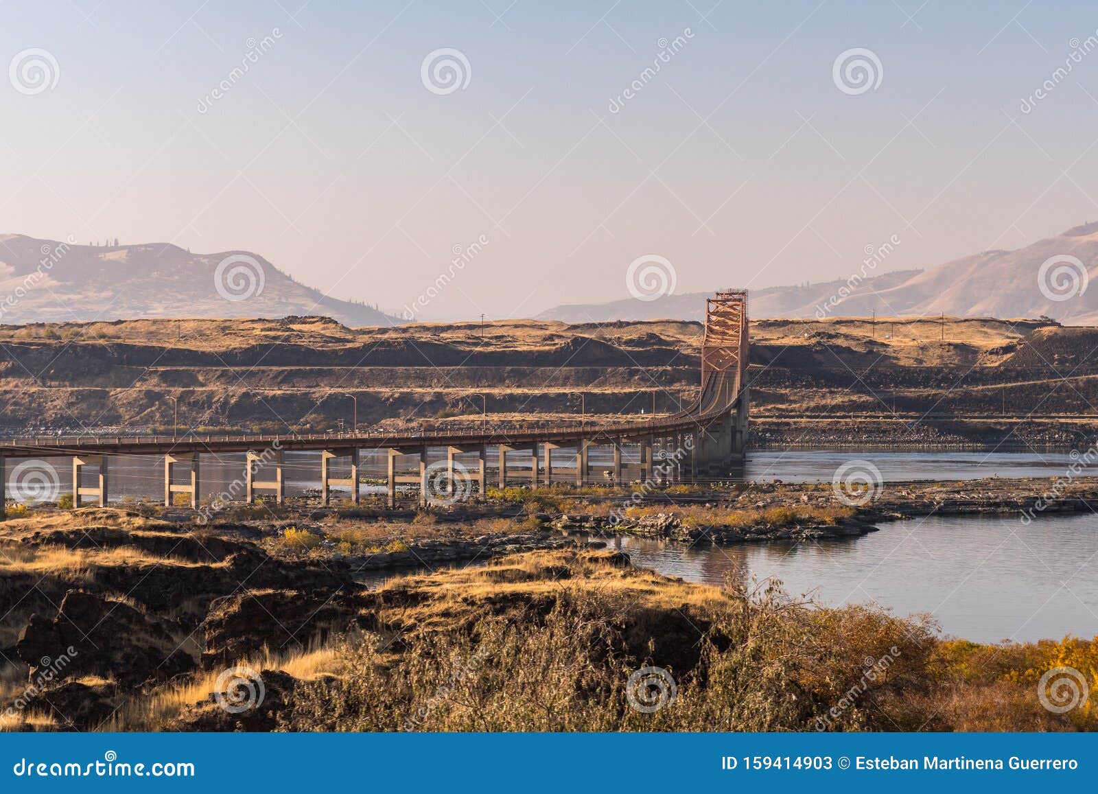 sunset view of the dalles bridge over the columbia river that separates washington and oregon states