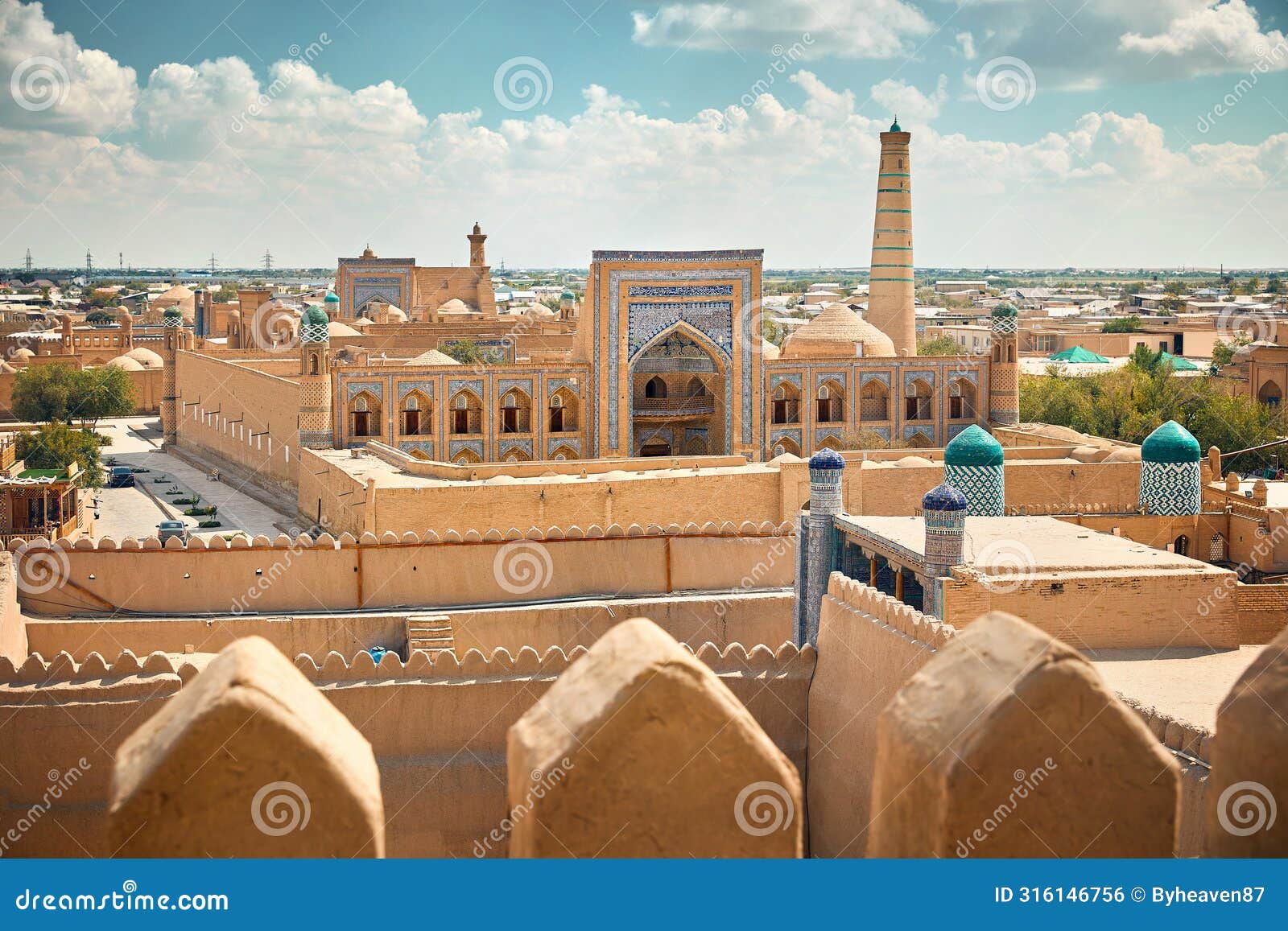 madrasah and kalta minor minaret in ancient city at khiva in uzbekistan