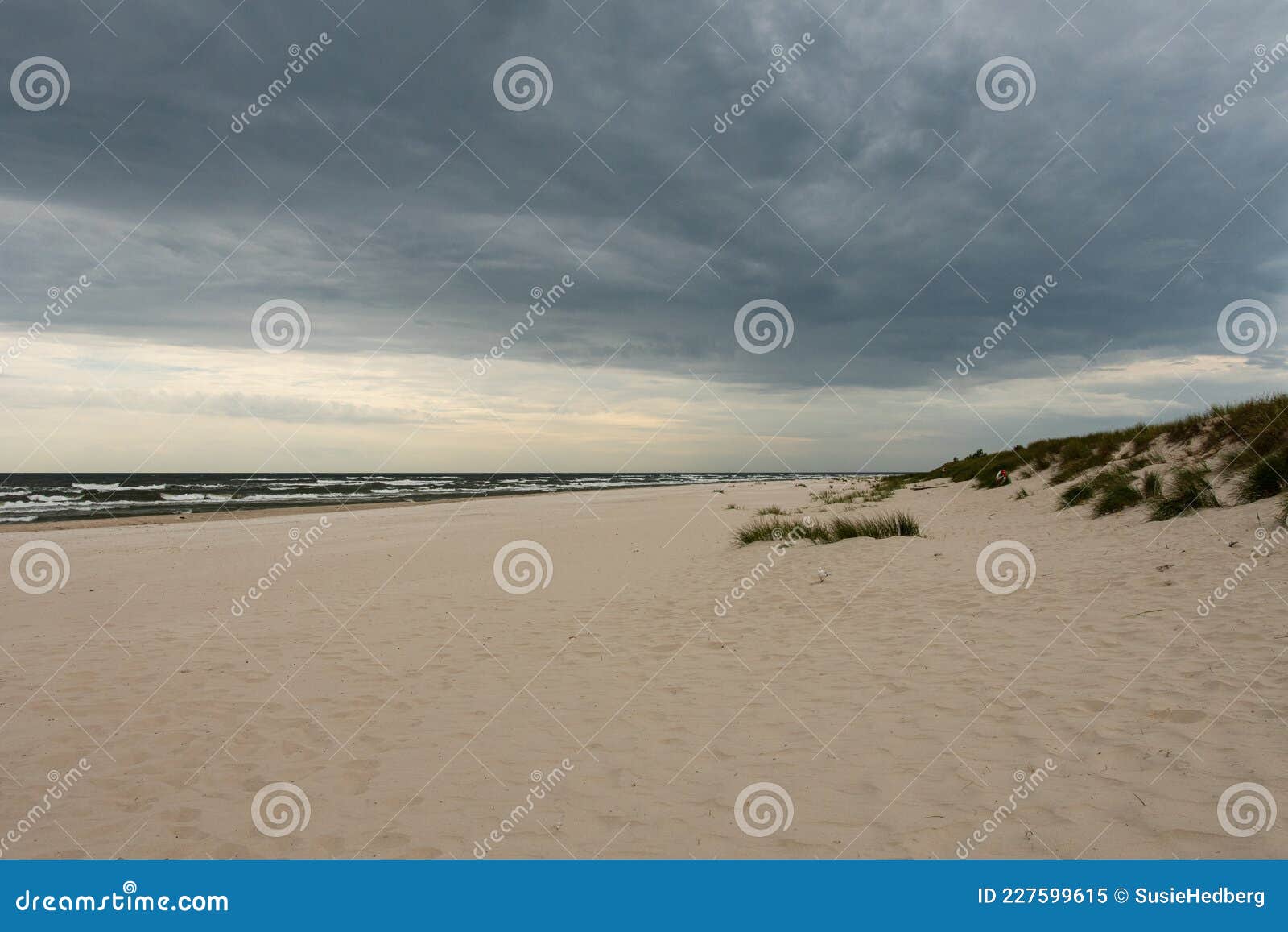 sunset view of sandhammaren beach with dramatic sky on a summer evening