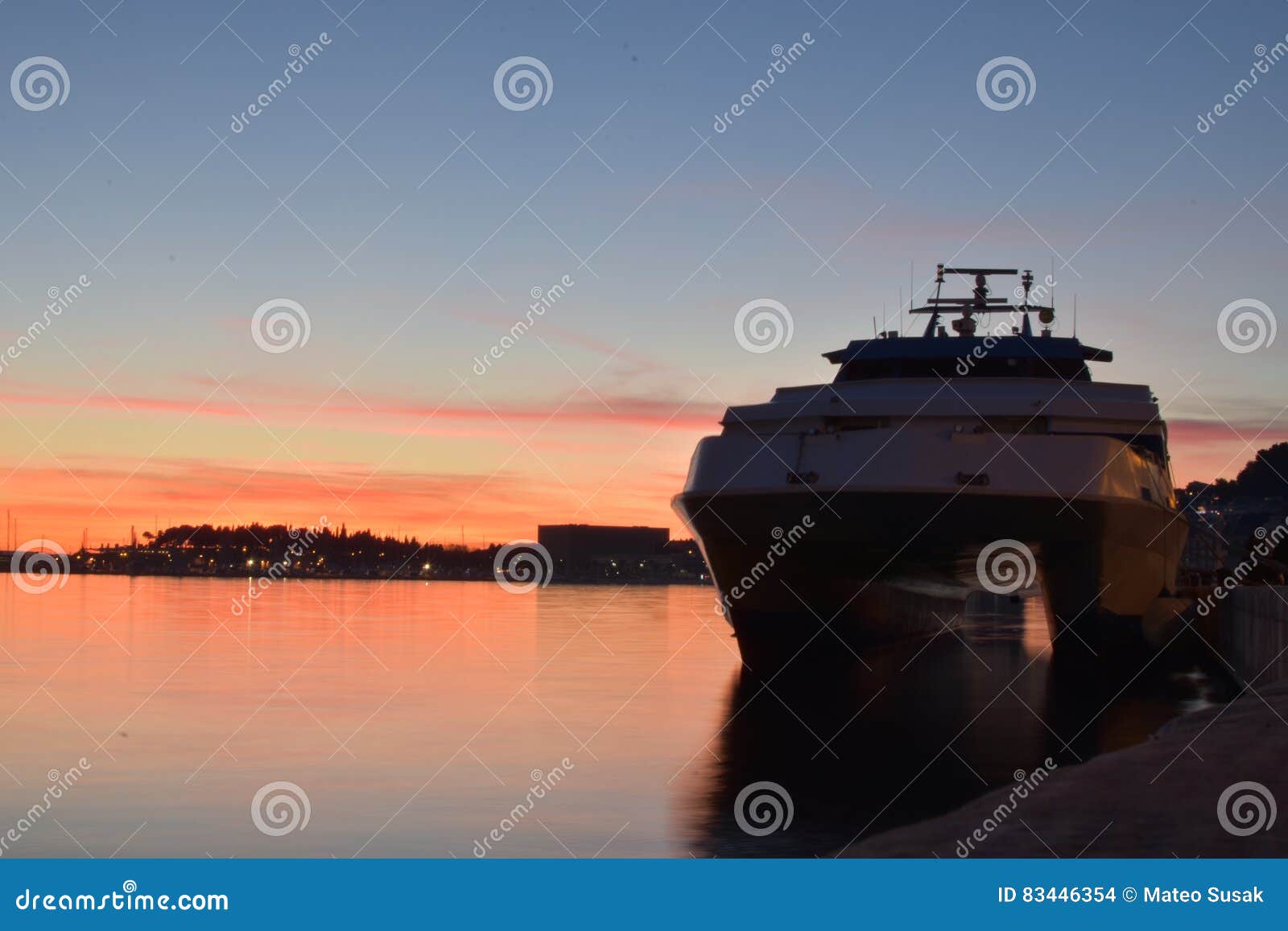 sunset with waiting boat to deliver passangers