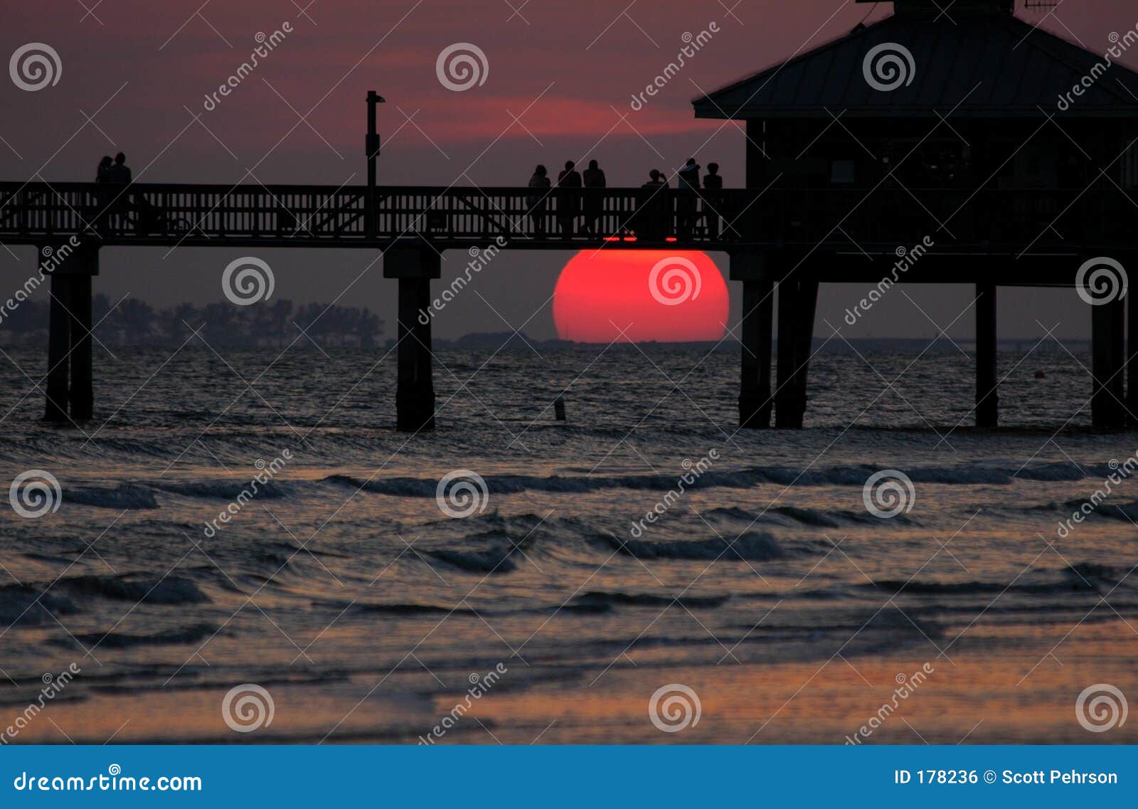 Sunset watchers stock photo. Image of pier, water, silhouettes - 178236