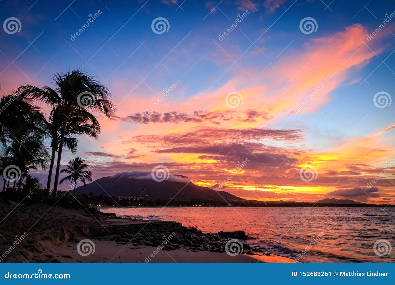 sunset in yellow and purple shades with a reflection in the sea, puerto plata, dominican republic, caribbean