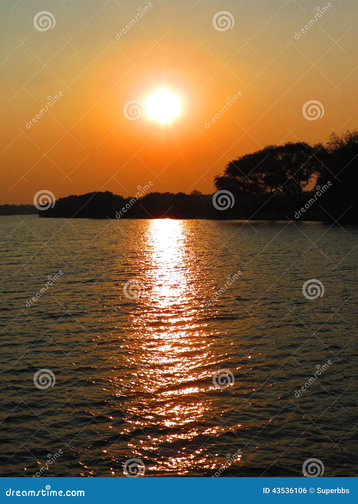 sunset on the zambezi river with sky and yellow sun