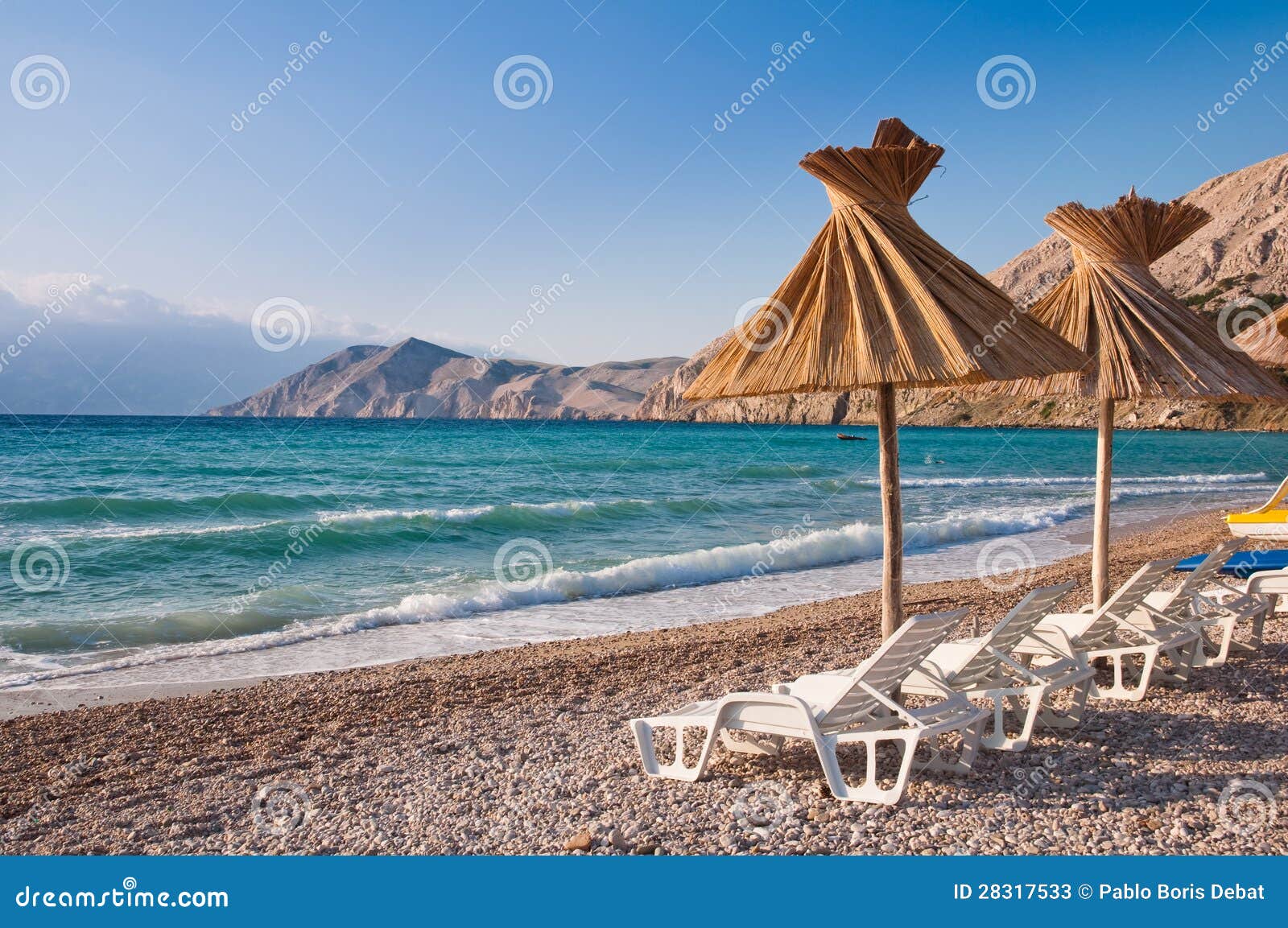 sunshade and deck chair on beach at baska in krk croatia