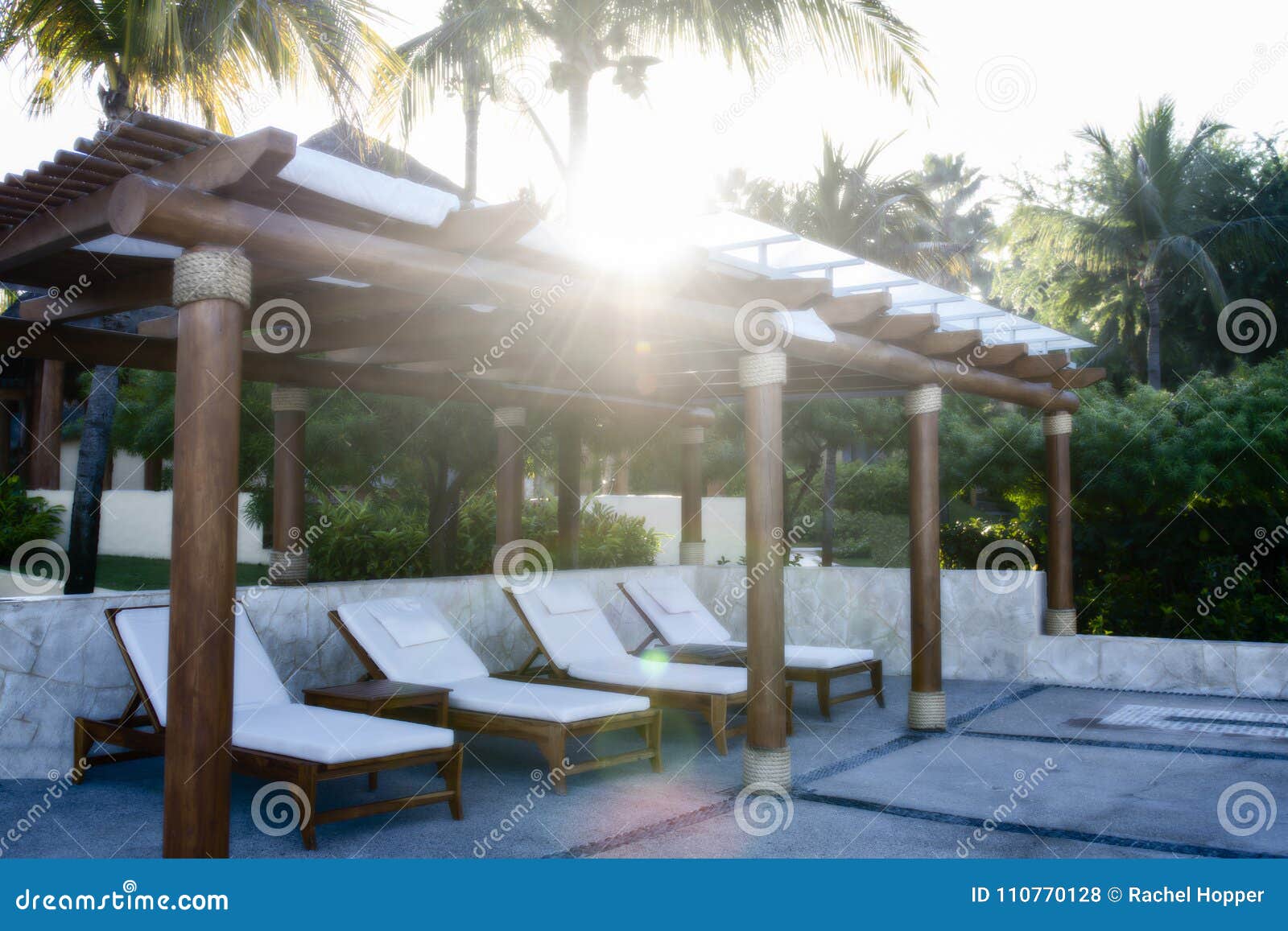 Chairs Under A Portico Poolside At A Beautiful Mexican Resort