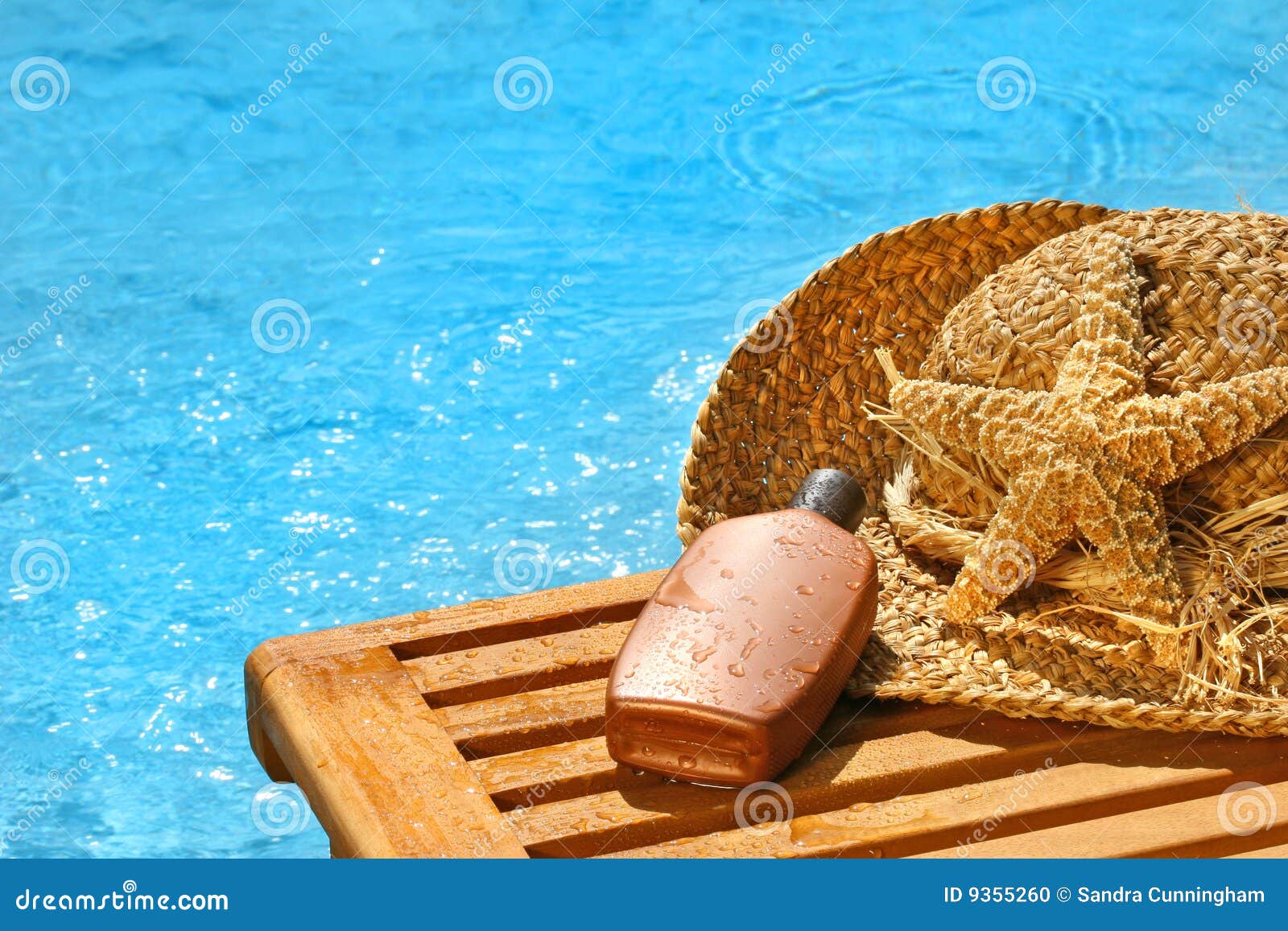 suntan lotion and straw hat